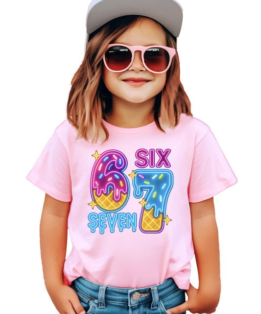 Close-up of neon donut and ice cream graphic print on black girls birthday shirt