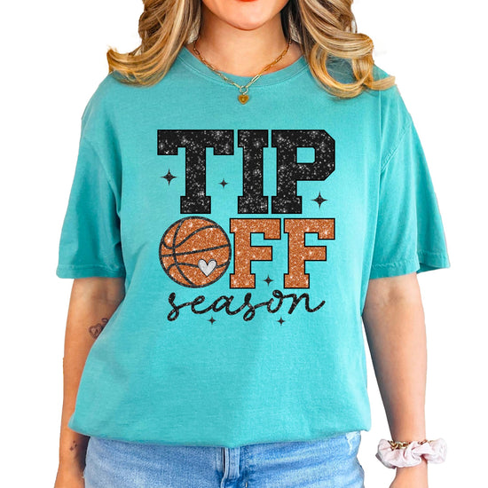 Close-up of faux glitter basketball and heart graphic on women's graphic tee