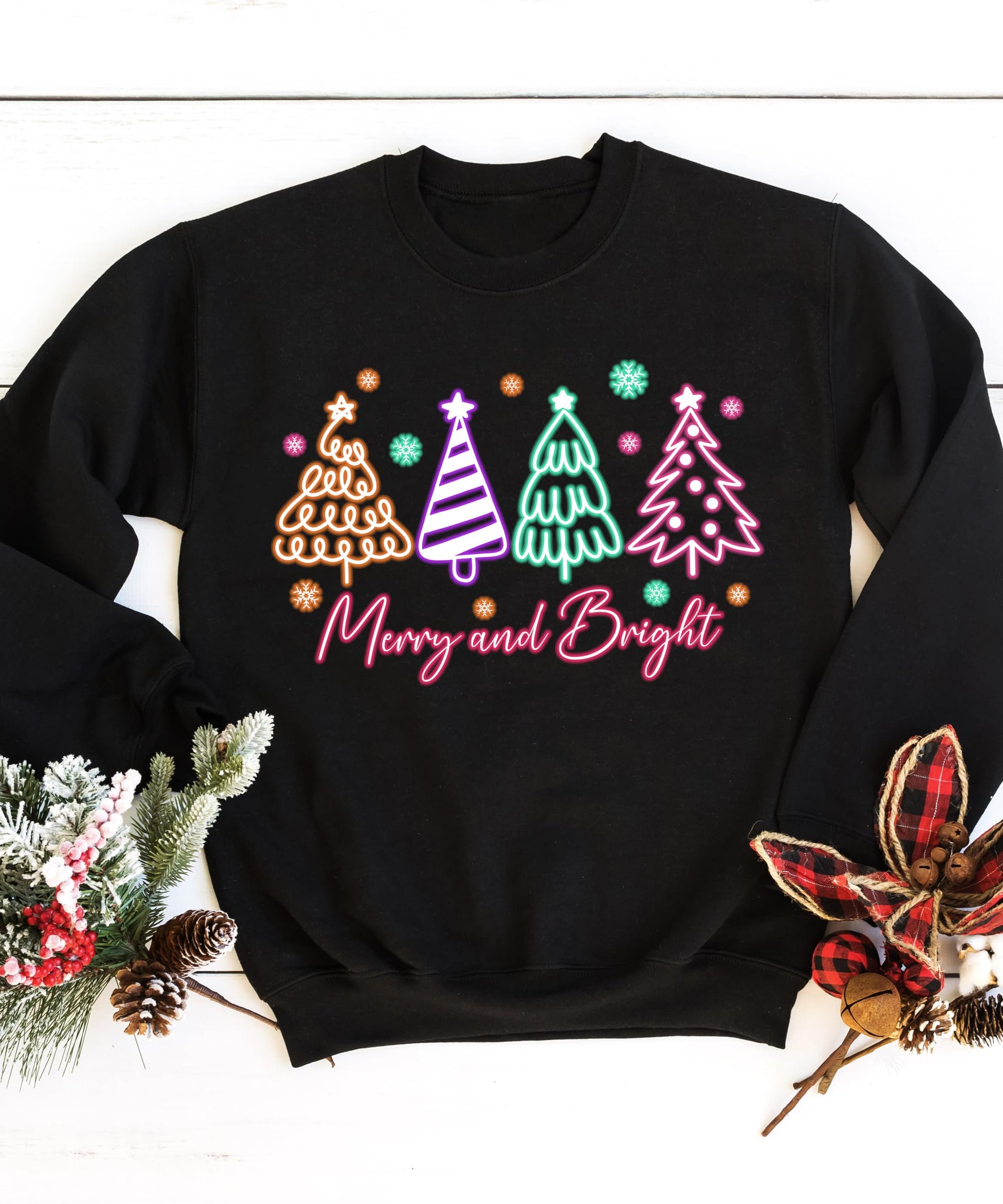 Women's Merry and Bright black sweatshirt with vibrant neon holiday tree design, front view