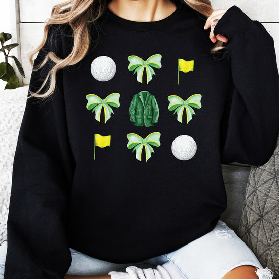 Lifestyle or detail shot of golf bows and balls graphic sweatshirt for women and teens
