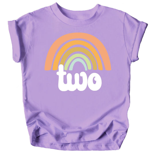 Toddler wearing purple second birthday rainbow shirt, full outfit view