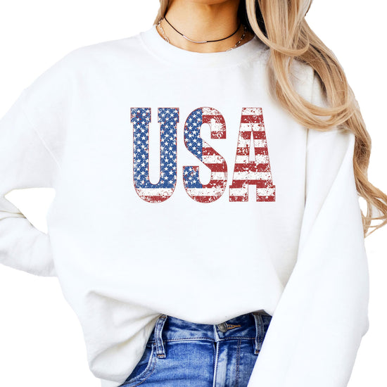 Distressed American flag crewneck sweatshirt detail shot showing print texture
