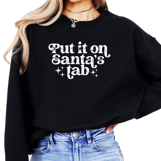 Back or lifestyle view of women's red holiday graphic sweatshirt with Santa humor design