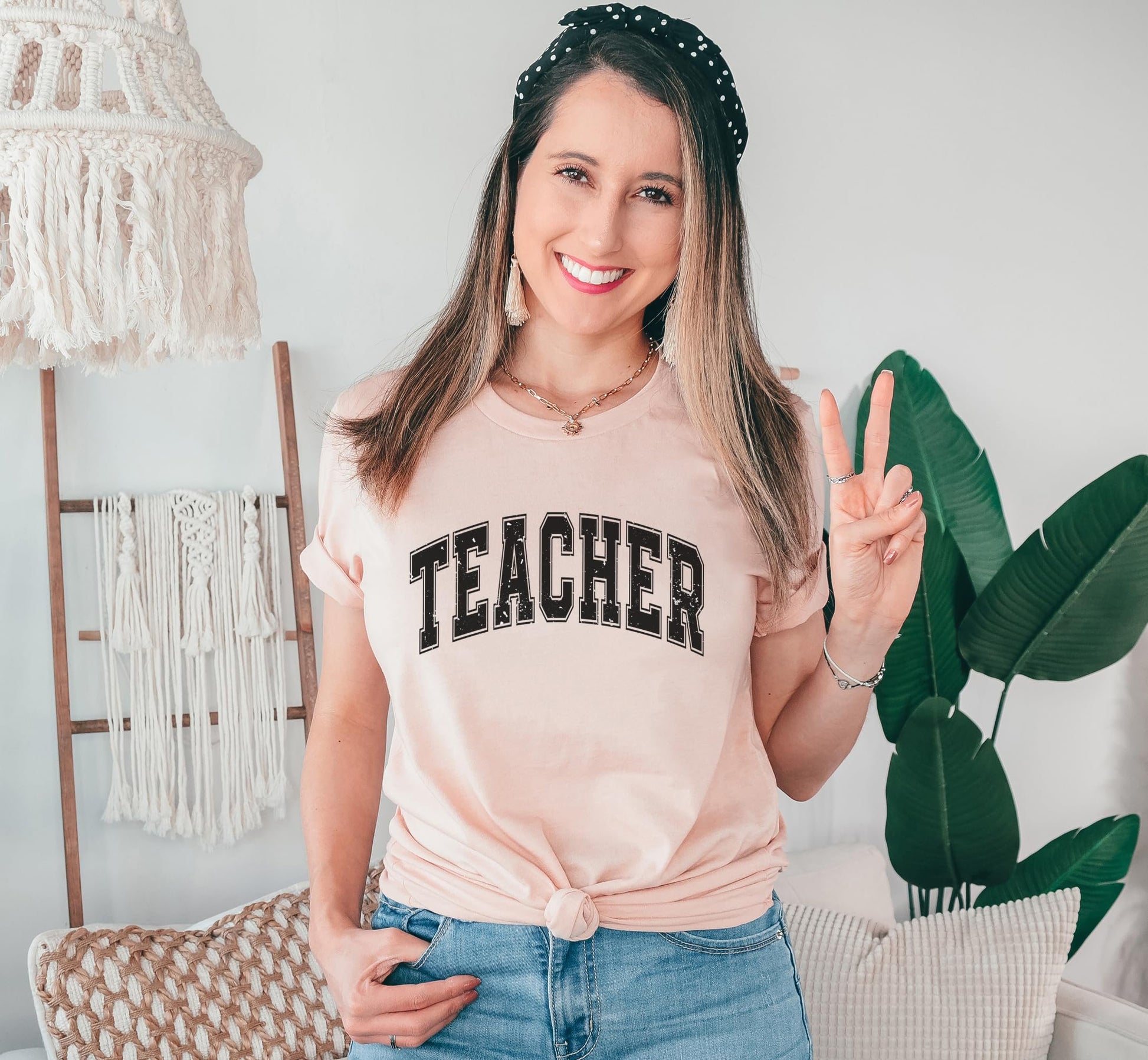 Collection of teacher varsity t-shirts in multiple colors - black, navy, and gray