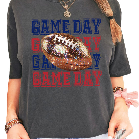 Front view of blue and red football game day shirt with stacked glitter graphic lettering