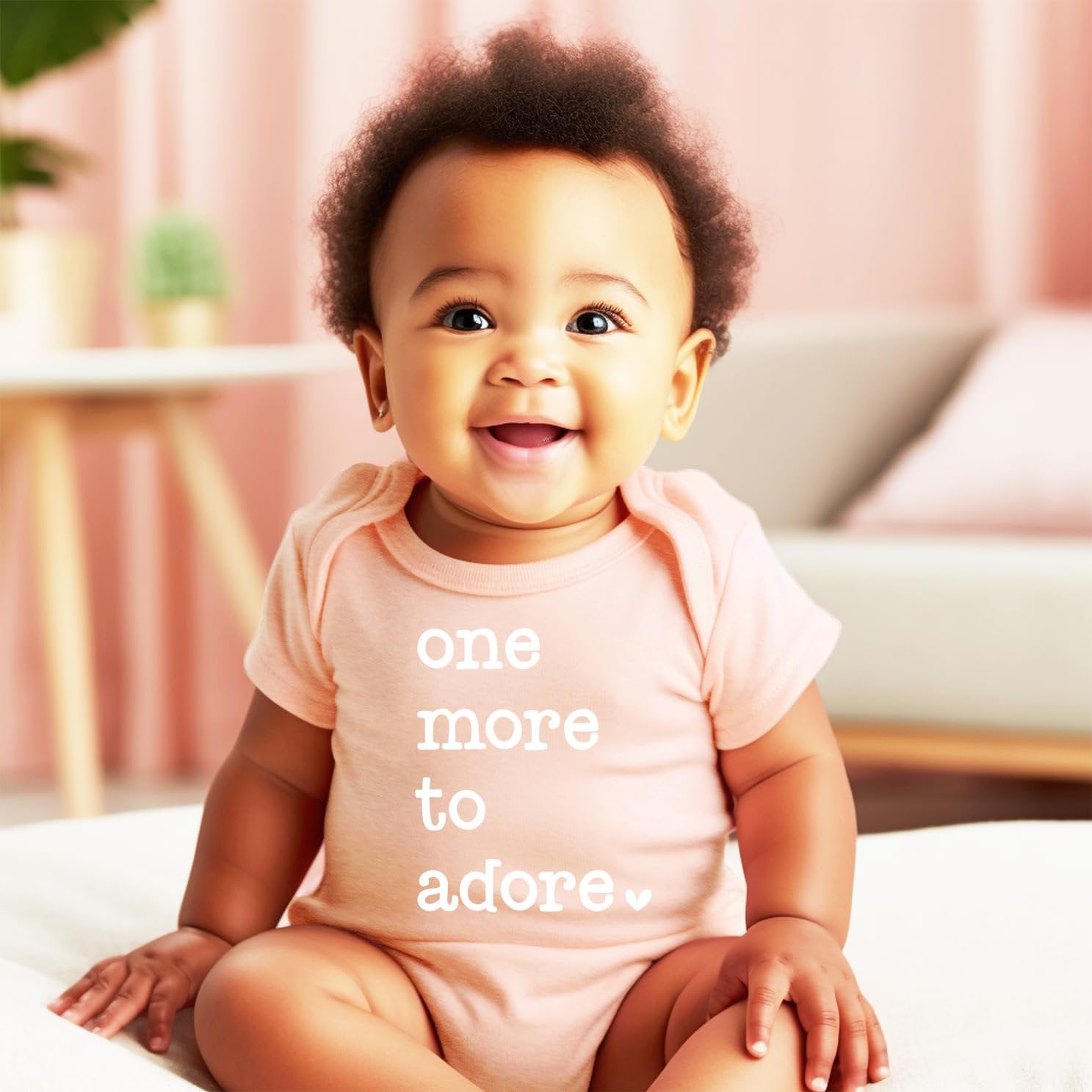 Olive Loves Apple One More to Adore newborn bodysuit styled for a pregnancy reveal photoshoot