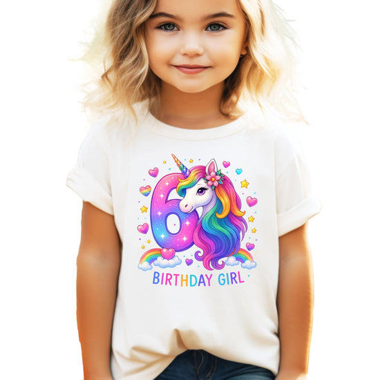 Front view of pink girls birthday shirt featuring colorful rainbow unicorn illustration