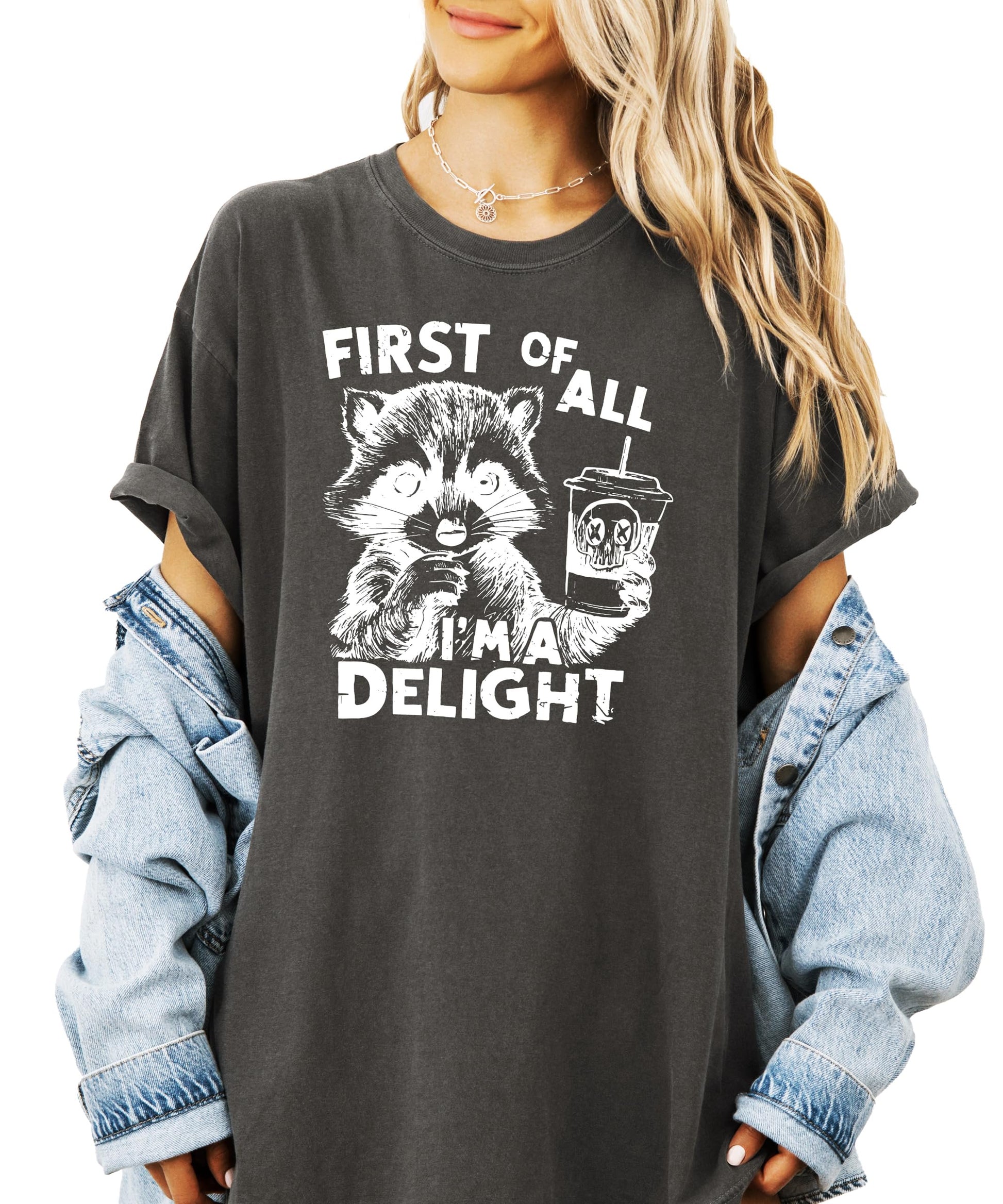 Close-up of raccoon holding a drink graphic print on ivory adult tee