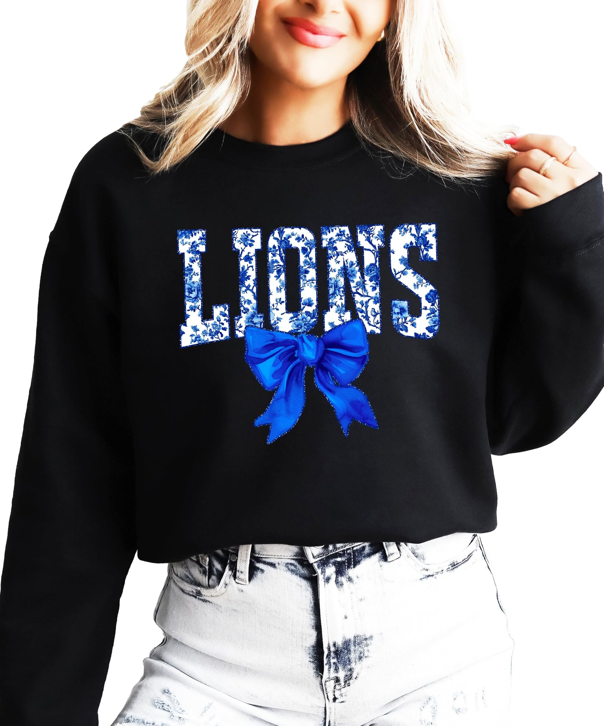 Front view of Lions coquette bow sweatshirt laid flat showing full graphic design
