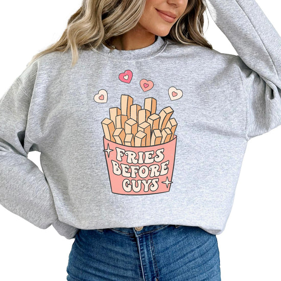 Flat lay of gray Fries Before Guys funny Valentine's sweatshirt by Olive Loves Apple