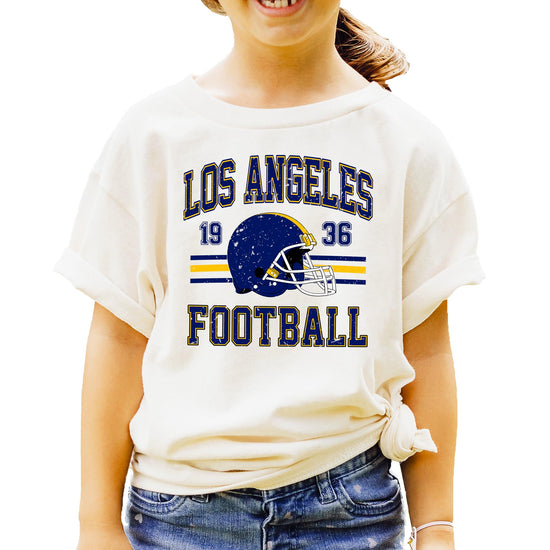 Detail shot of blue and gold Los Angeles Football 1936 vintage graphic with classic helmet and distressed lettering