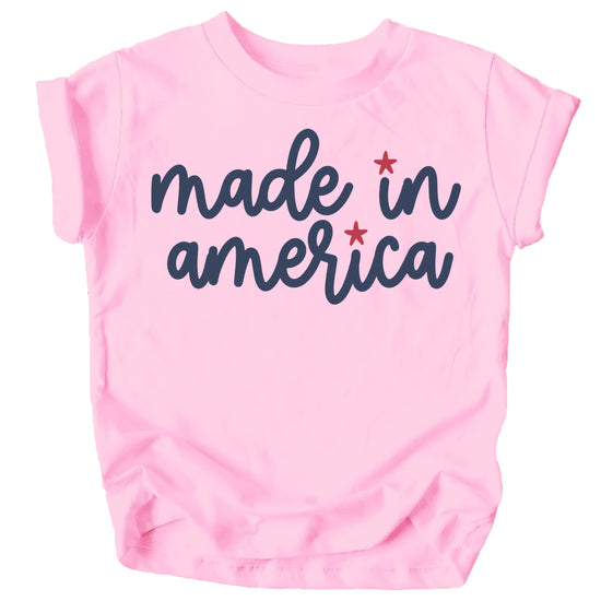 Close-up of Made in America patriotic graphic print on pink kids tee