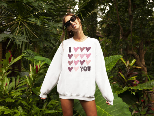 Front view of cozy Valentine's Day graphic sweatshirt from Olive Loves Apple with I Love You design