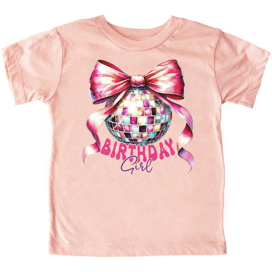 Close-up of coquette-style disco ball with large pink bow graphic on kids birthday girl t-shirt
