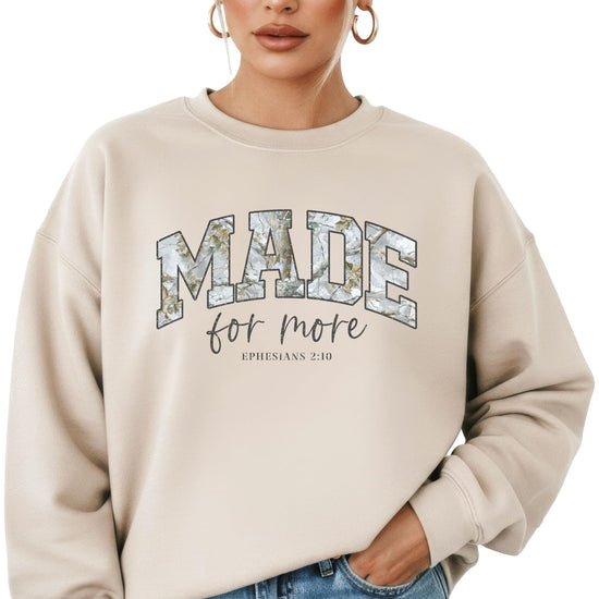 Woman wearing camo Made for More Christian faith sweatshirt front view