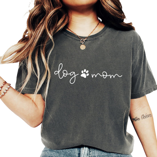 Close-up of puppy paw graphic print on seafoam Dog Mom women's tee