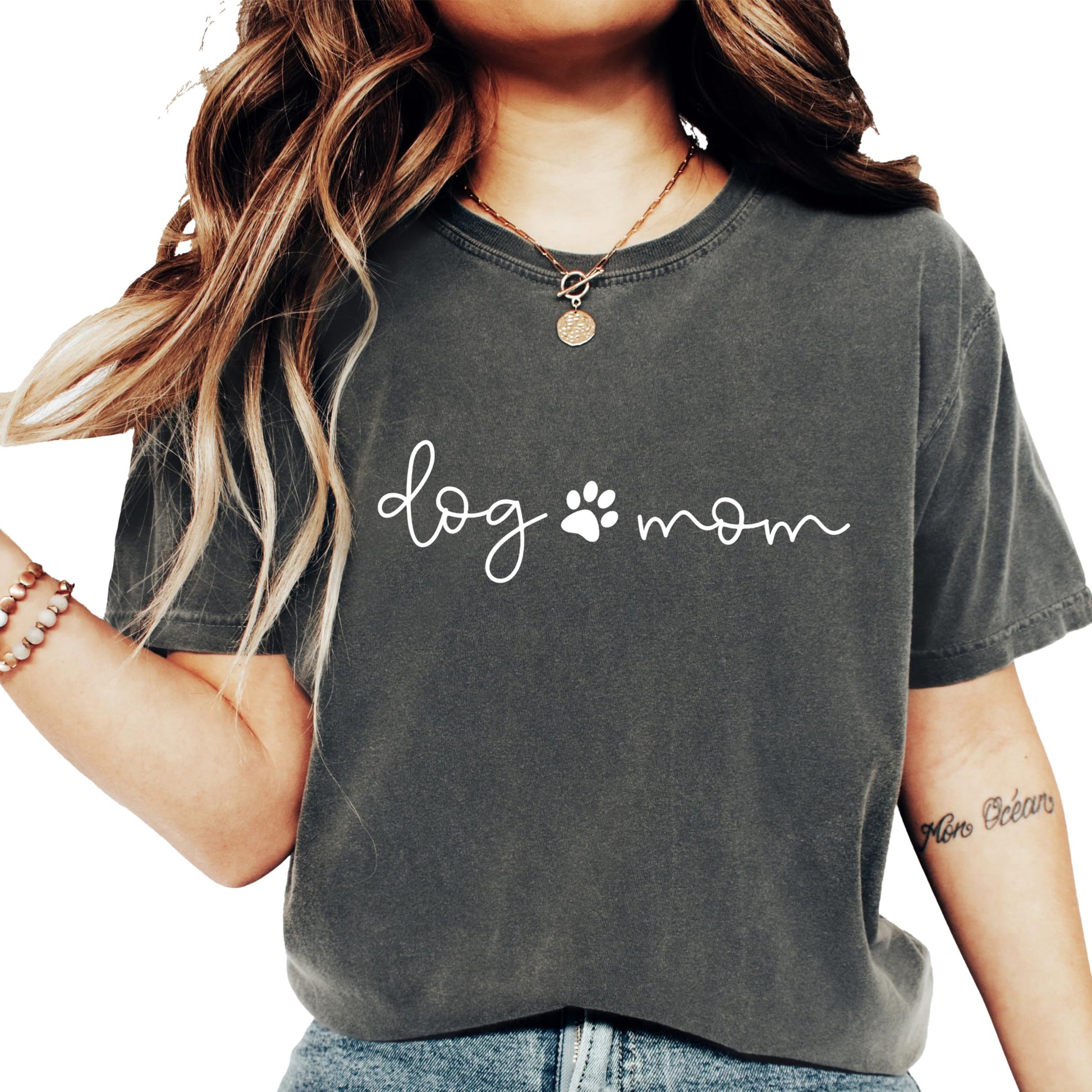 Close-up of puppy paw graphic print on seafoam Dog Mom women's tee