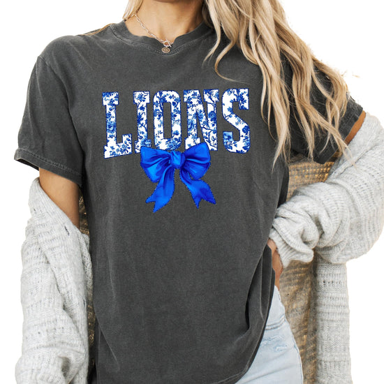 Close-up of Lions floral lettering with decorative blue bow detail