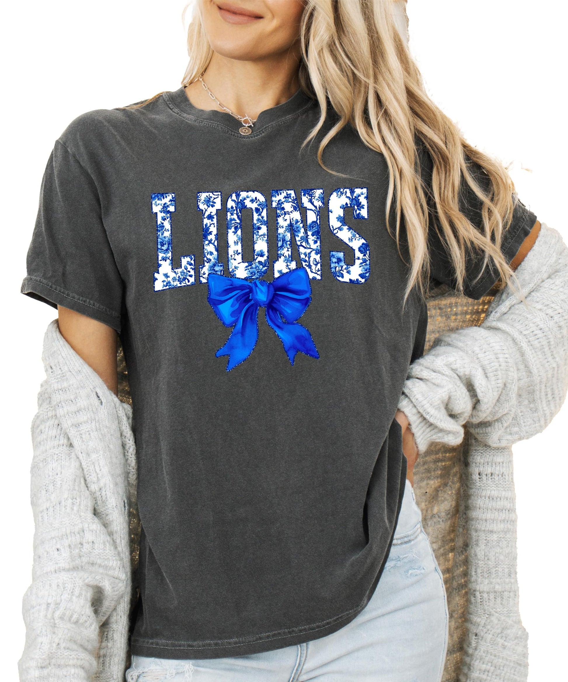 Close-up of Lions floral lettering with decorative blue bow detail