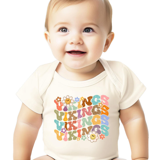 Trendy Vikings fan shirt with rainbow groovy letters and smiley faces on natural colored tee