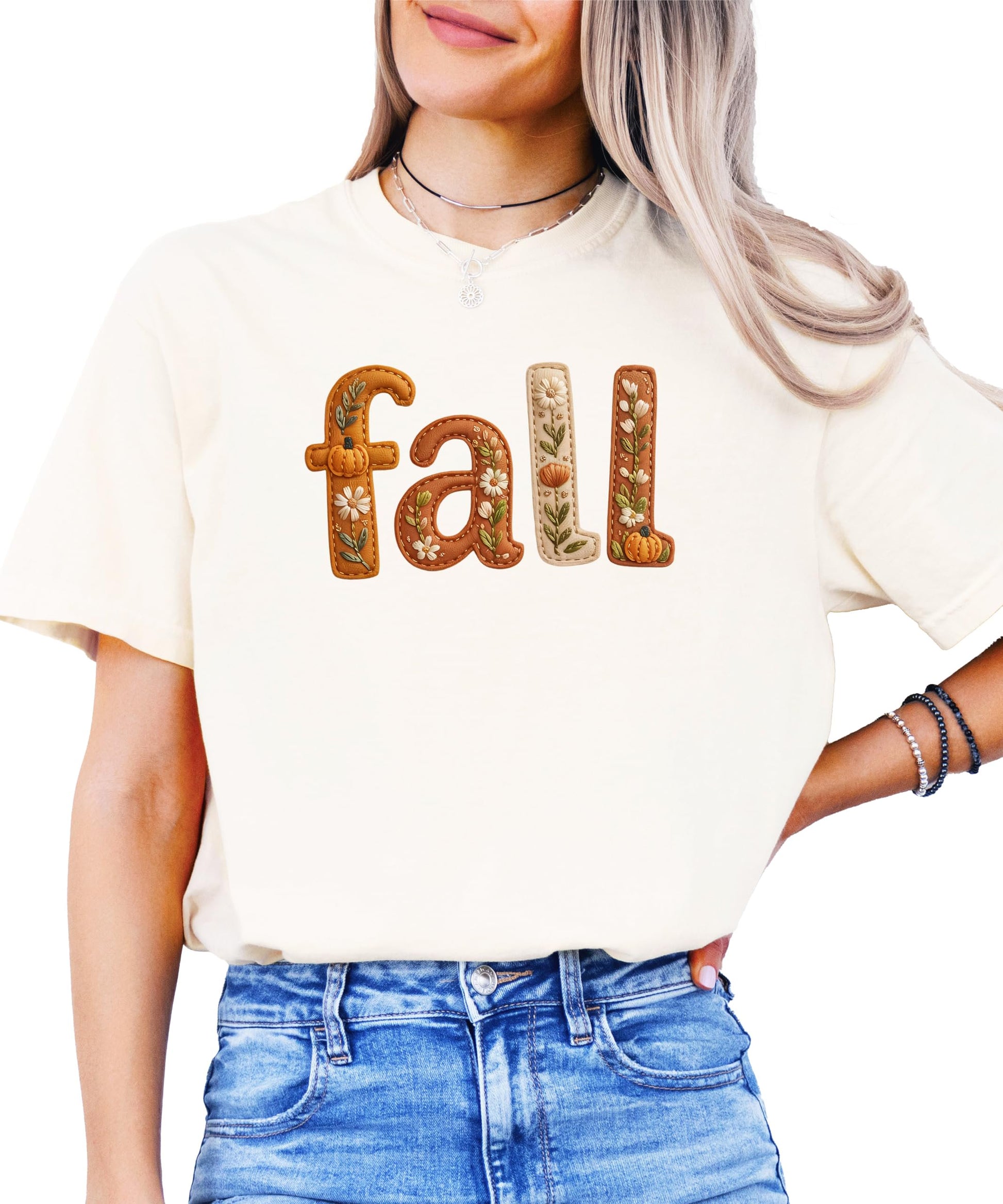 Model wearing seafoam fall shirt with pumpkin and flower embroidery look