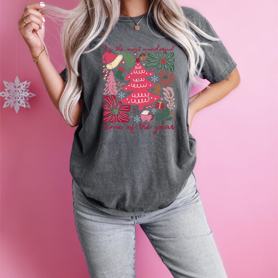 Women's ivory Christmas shirt with colorful festive holiday collage design, styled flat lay