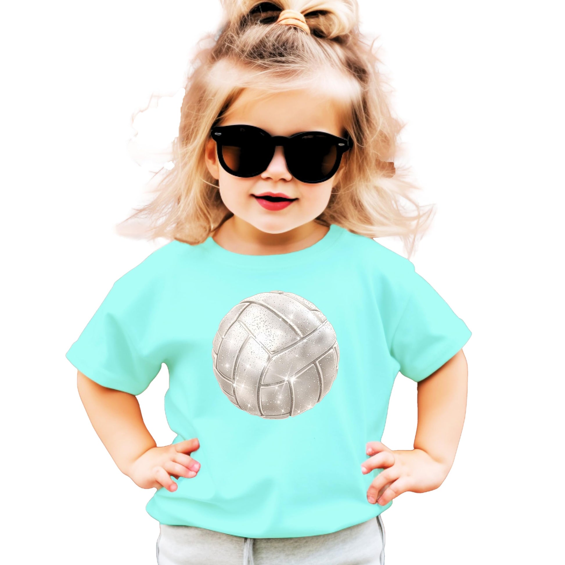 Close-up of faux glitter volleyball design on youth natural tee