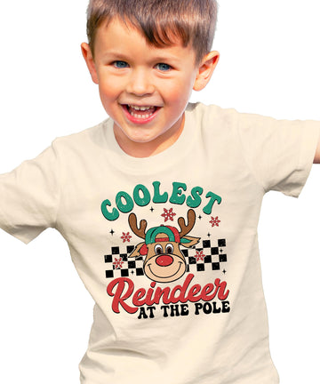 Front view of kids Christmas reindeer graphic tee in natural color, Coolest Reindeer at the Pole design