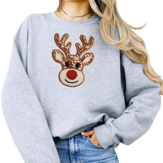 Detail shot of cute reindeer nose and antler print on black holiday sweatshirt