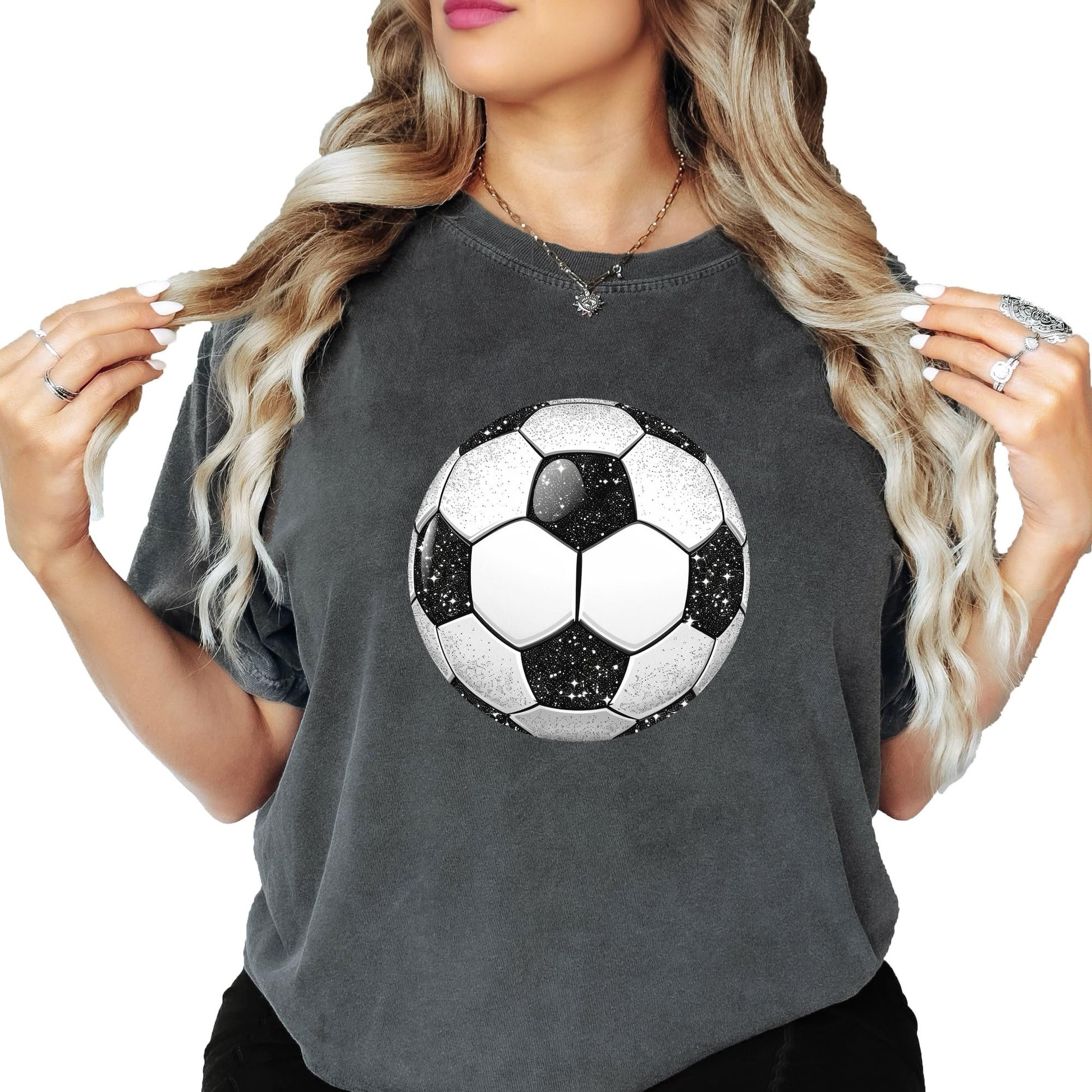 Detail shot of high-quality faux glitter soccer ball print on women's shirt