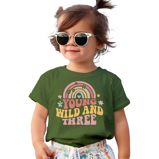 Young Wild Three retro rainbow birthday shirt on natural colored toddler tee