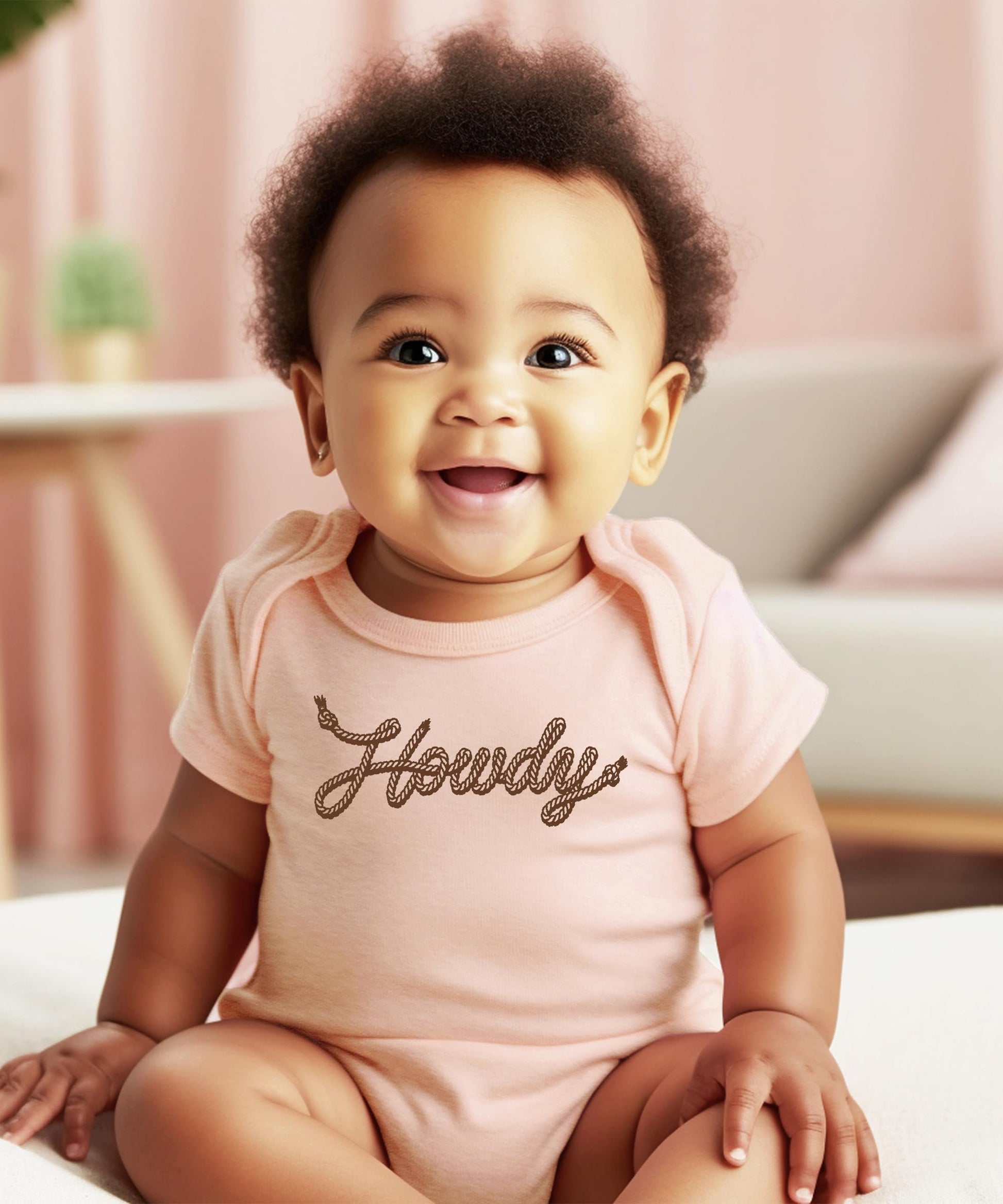 Side view of peach western Howdy baby bodysuit, soft fabric with snap closure for newborns