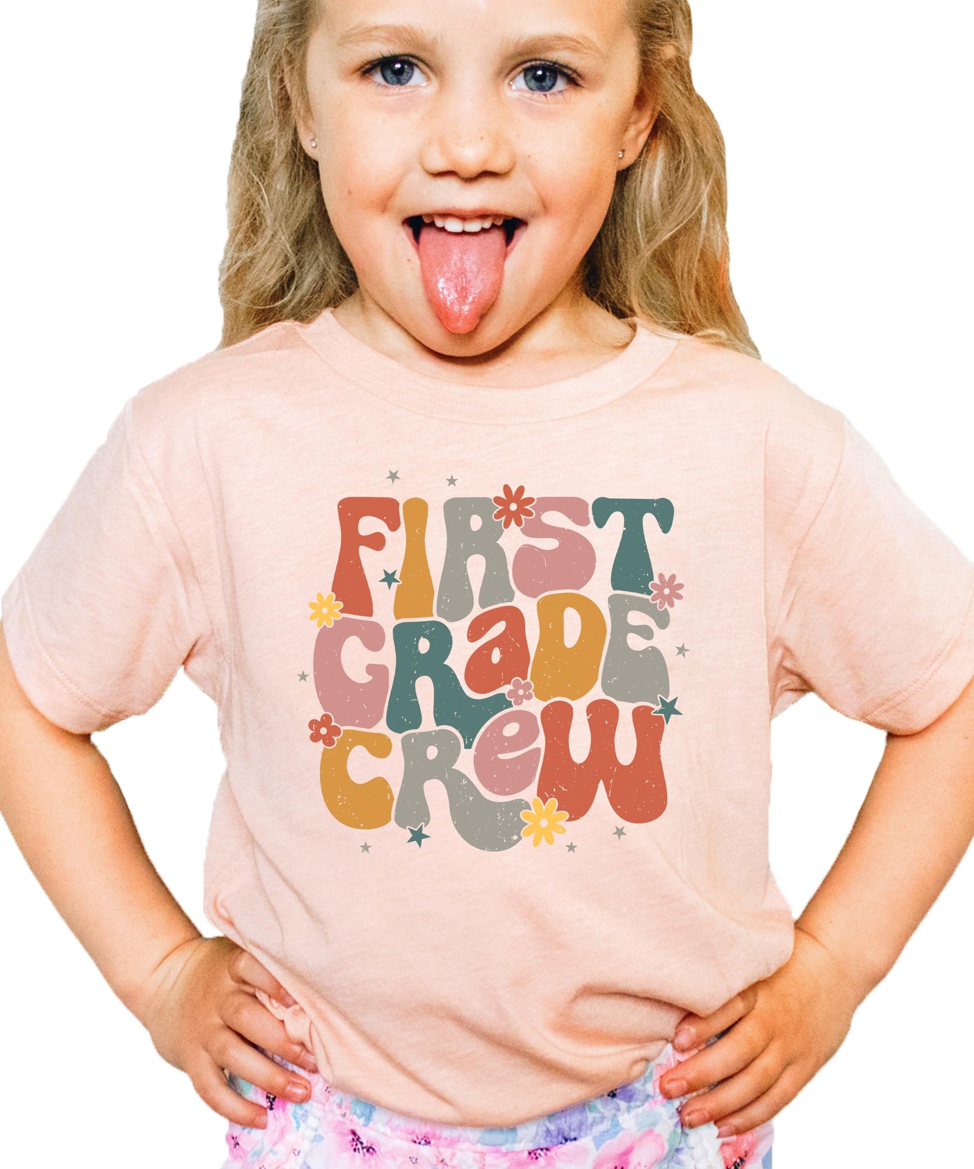 Young girl wearing First Grade Crew back to school graphic tee, full outfit view