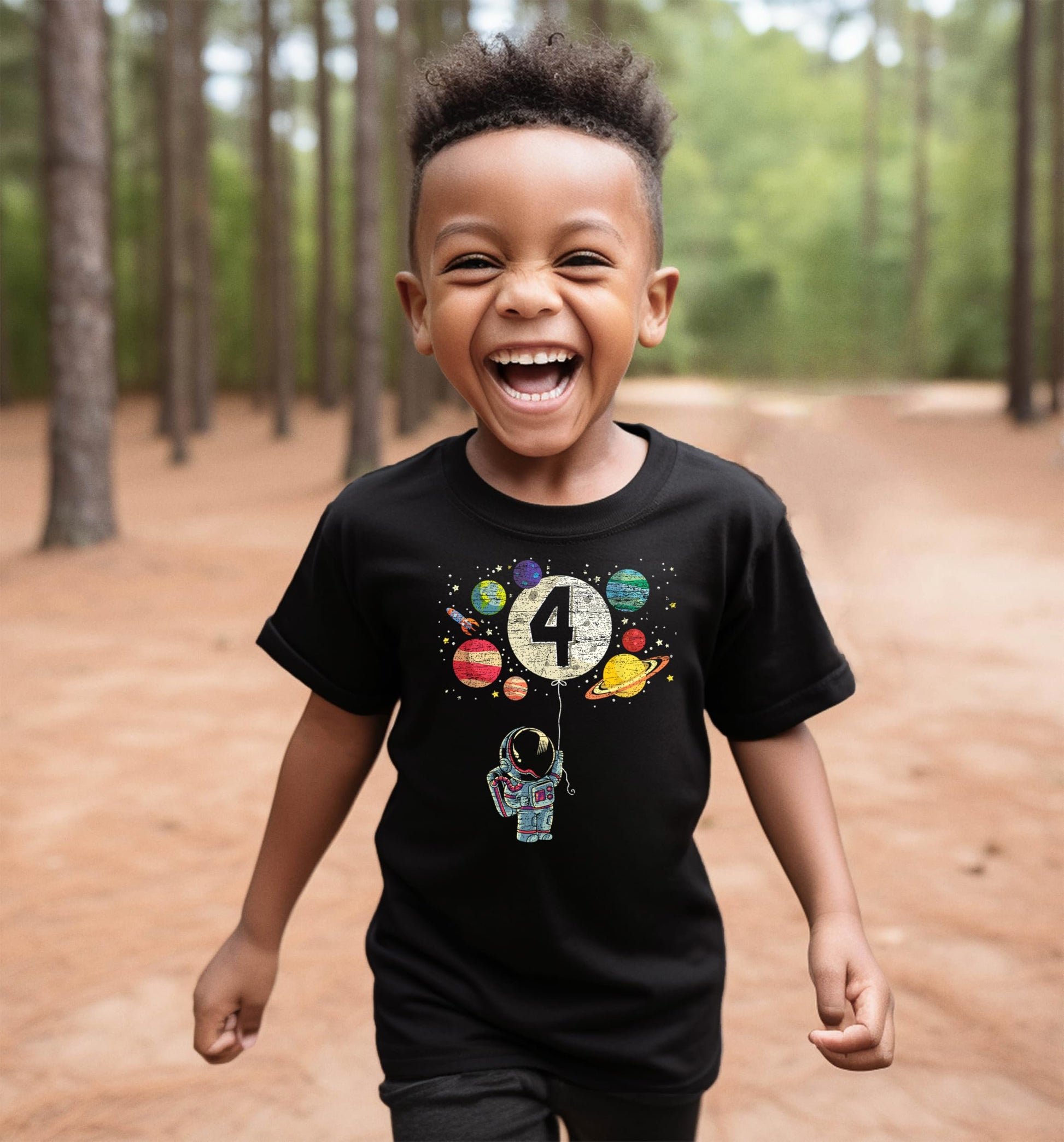 Detail shot of vibrant USA-printed astronaut and moon balloon graphic on black kids birthday shirt