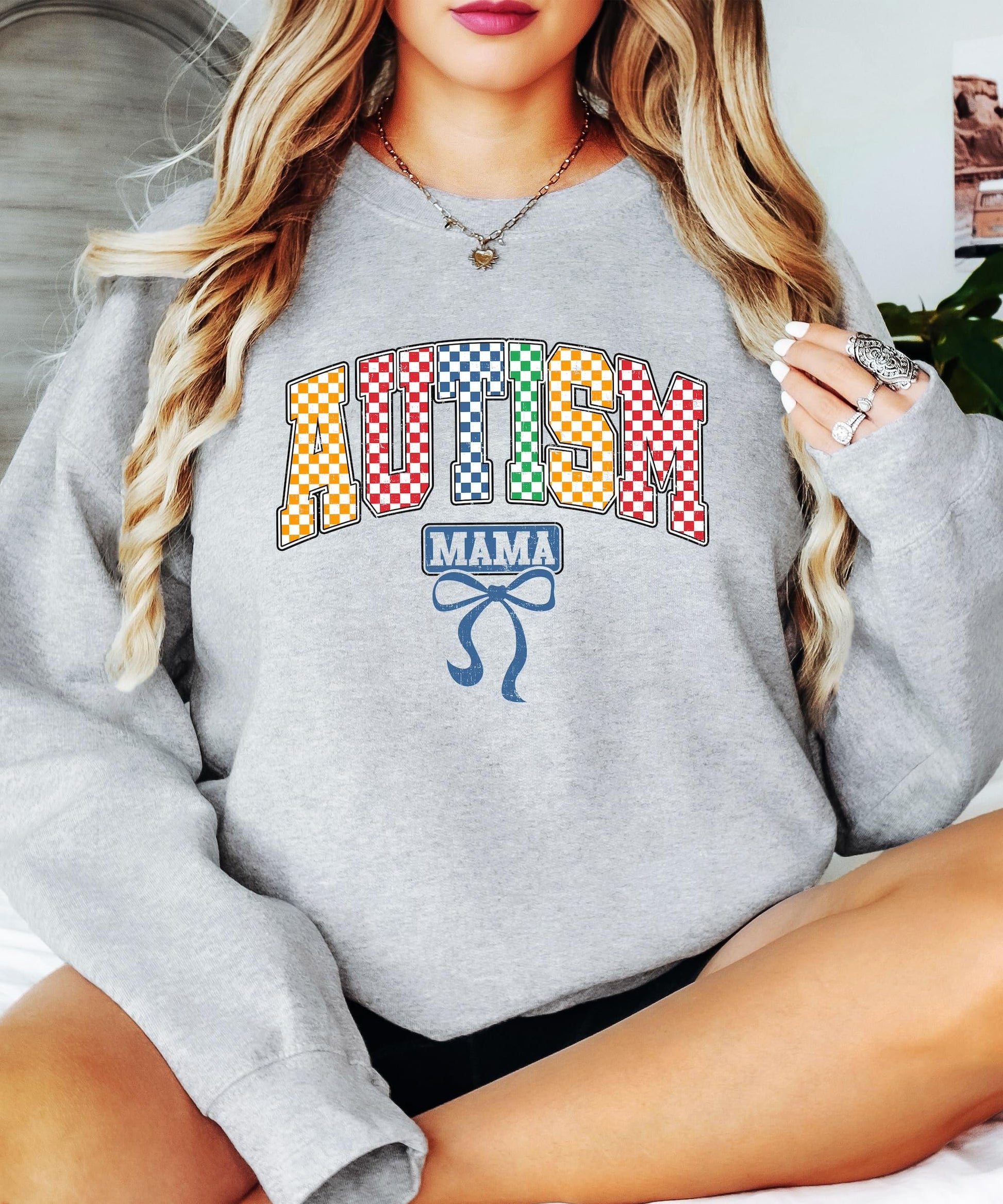 Detail shot of high-quality checkered print on Autism Mama women's sweatshirt