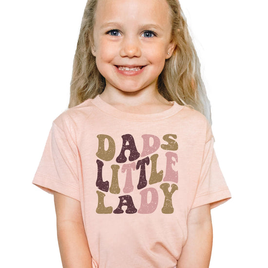 Close-up of distressed retro print on Dad's Little Lady natural kids graphic tee
