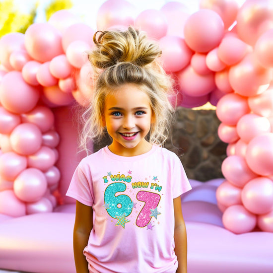 Detail shot of glitter print quality on pink kids' birthday t-shirt