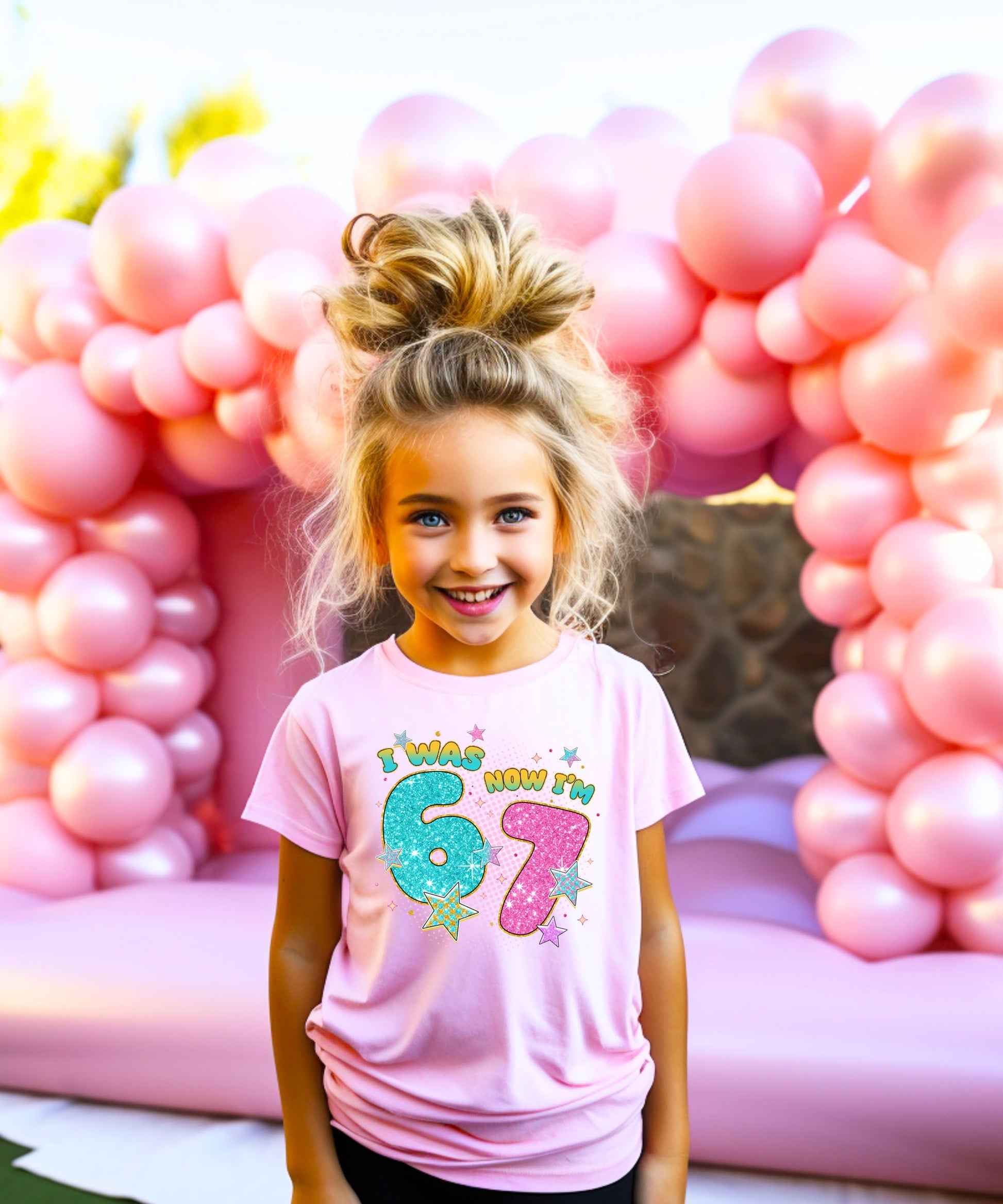 Detail shot of glitter print quality on pink kids' birthday t-shirt