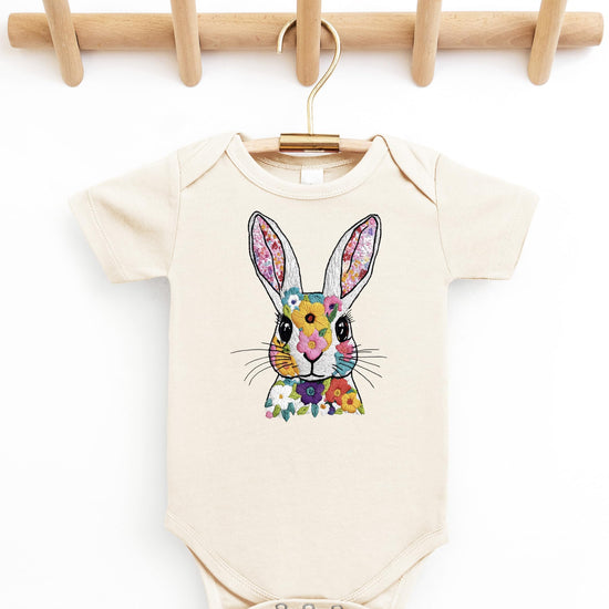 Side angle of baby wearing floral Easter rabbit onesie for springtime outfit