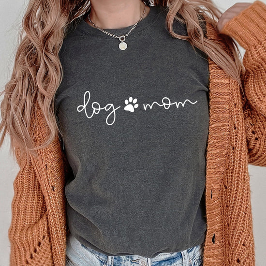 Flat lay of seafoam Dog Mom puppy paw women's t-shirt from Olive Loves Apple