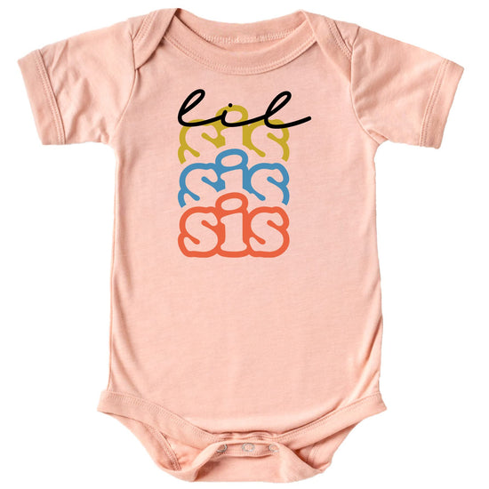 Close-up of colorful Little Sister graphic print on mauve girls tee or bodysuit
