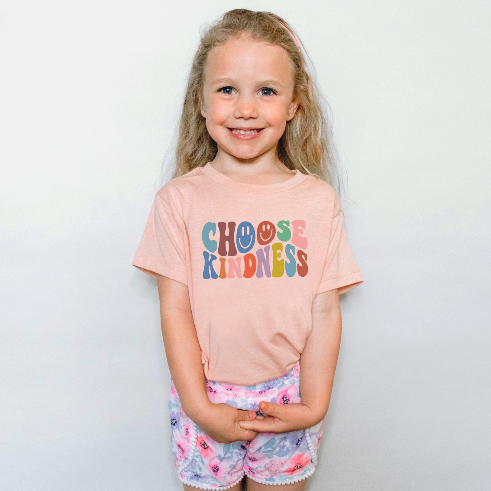 Choose Kindness girls graphic tee laid flat showing full colorful retro design