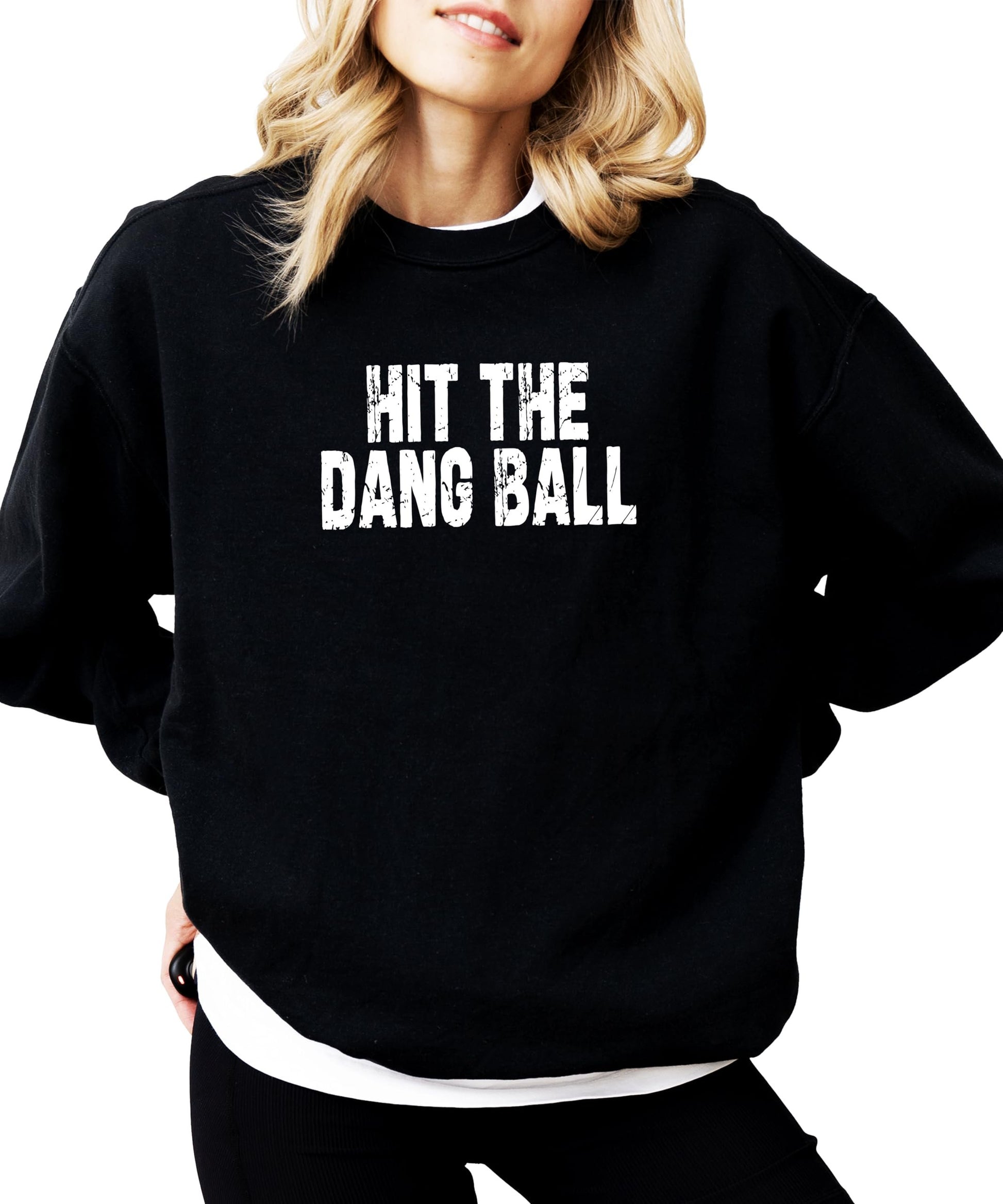 Detail shot of vintage-style Hit The Dang Ball graphic on cozy red women's sweatshirt