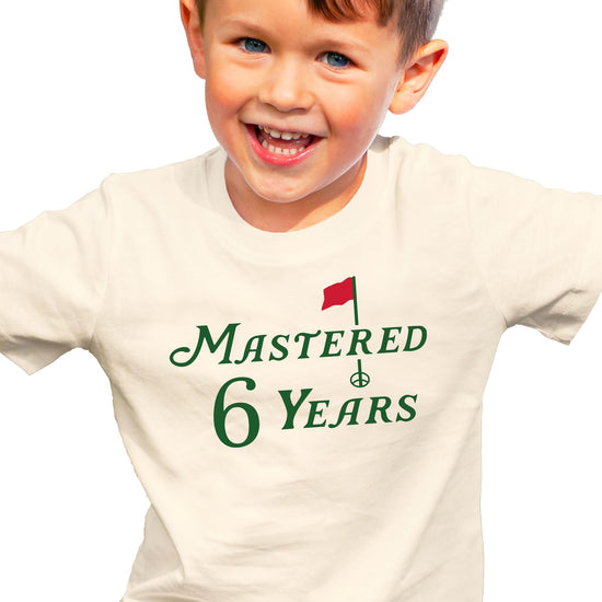 Front view of golf themed birthday shirt for boys and girls turning six