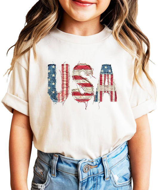 Pink distressed USA flag graphic tee for women with weathered vintage Americana design
