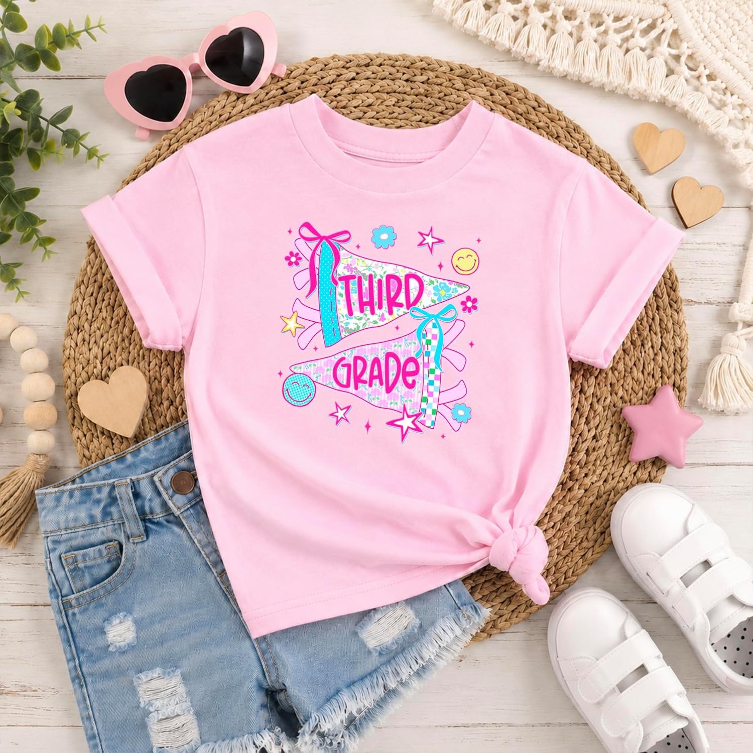 Pink and natural color options for girls third grade floral pennant back to school graphic tee by Olive Loves Apple