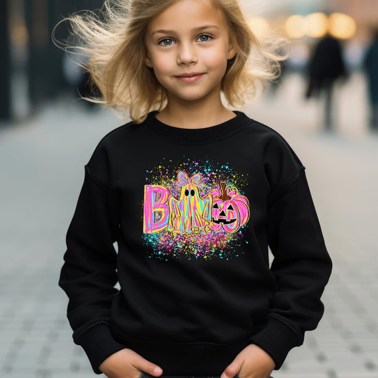 Women modeling neon Halloween ghost and pumpkin graphic sweatshirt in cozy pullover style