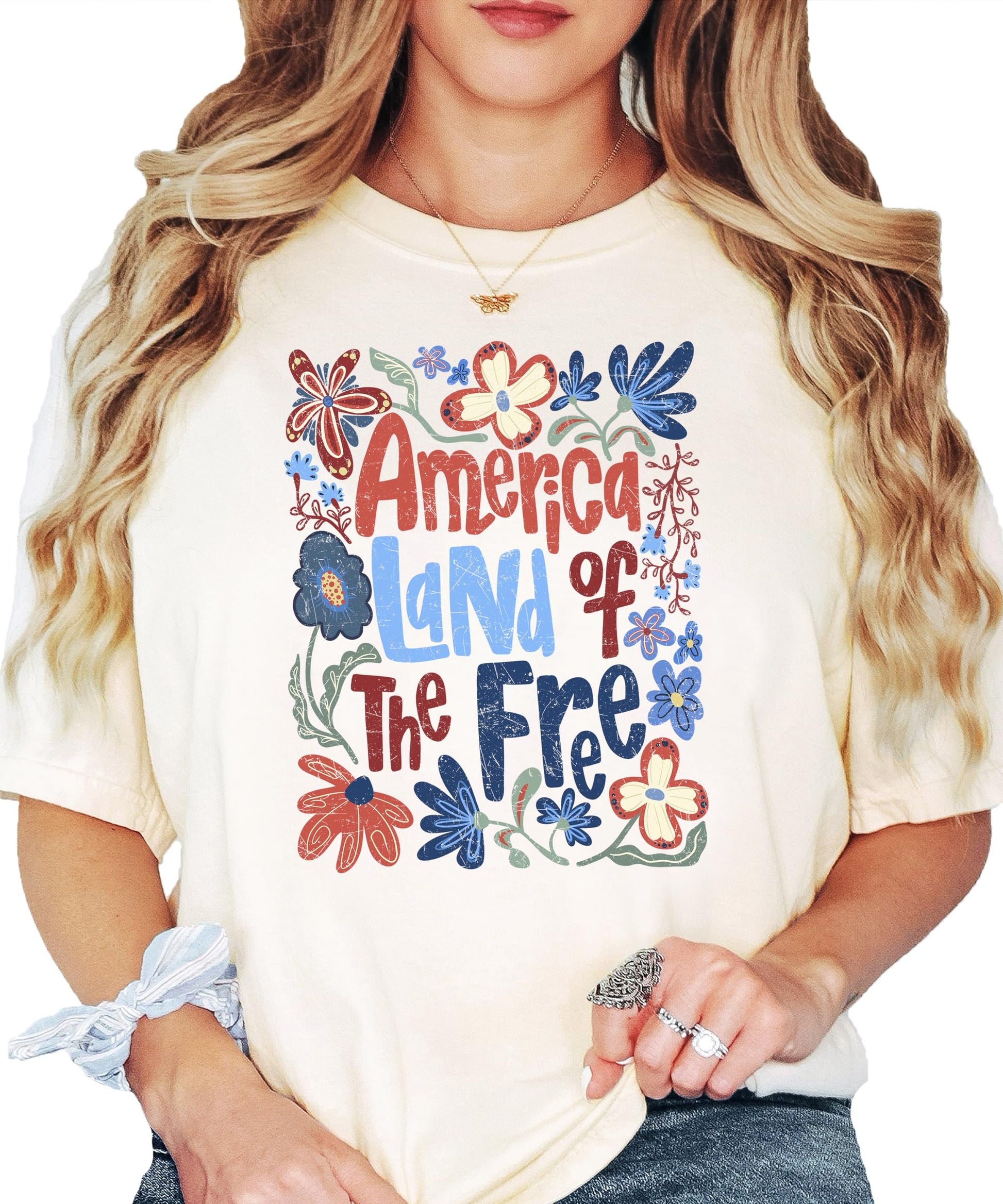 Close-up of floral patriotic graphic print on America Land of the Free women's tee