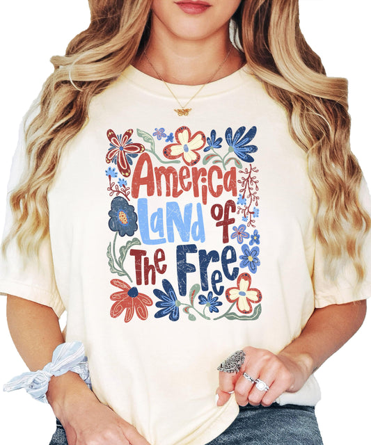 Close-up of floral patriotic graphic print on America Land of the Free women's tee