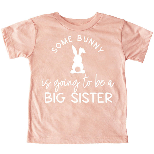Some Bunny is Going to Be a Big Sister peach graphic tee for kids with Easter bunny design